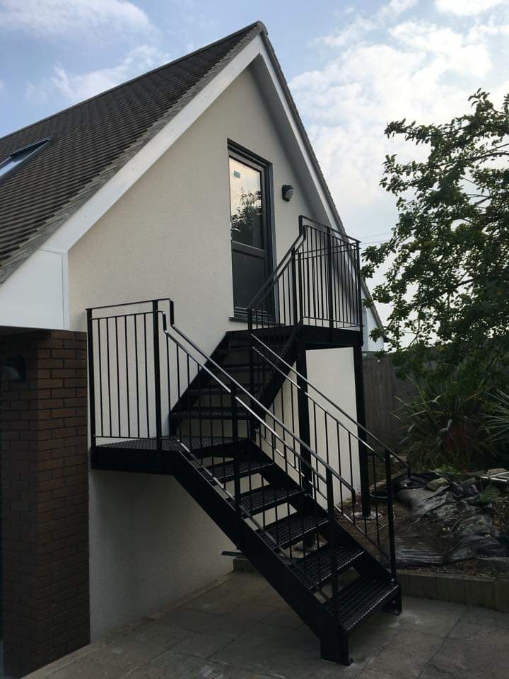 A lovely rear access steel staircase in powder coated black