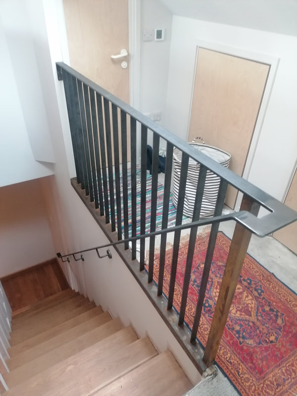 Lovely contempory steel balustrade and handrail in this house
