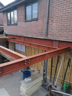 Structural steel frame to support external wall and provide frame for roof-lantern