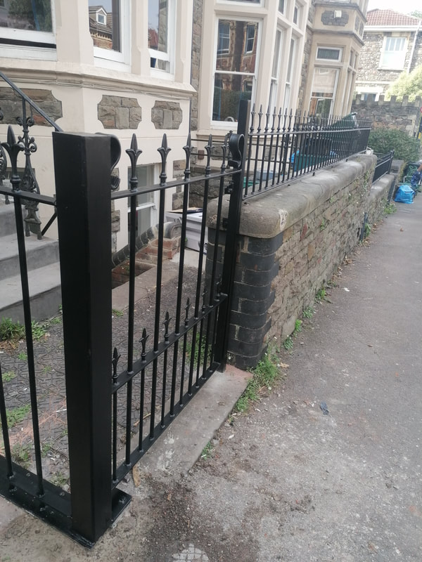 Pedestrian painted metal gate in Bristol