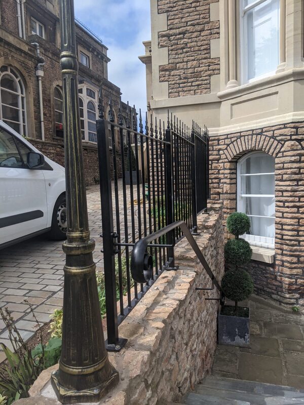 Metal railings with fleur de lys railhead to finish this Clifton home