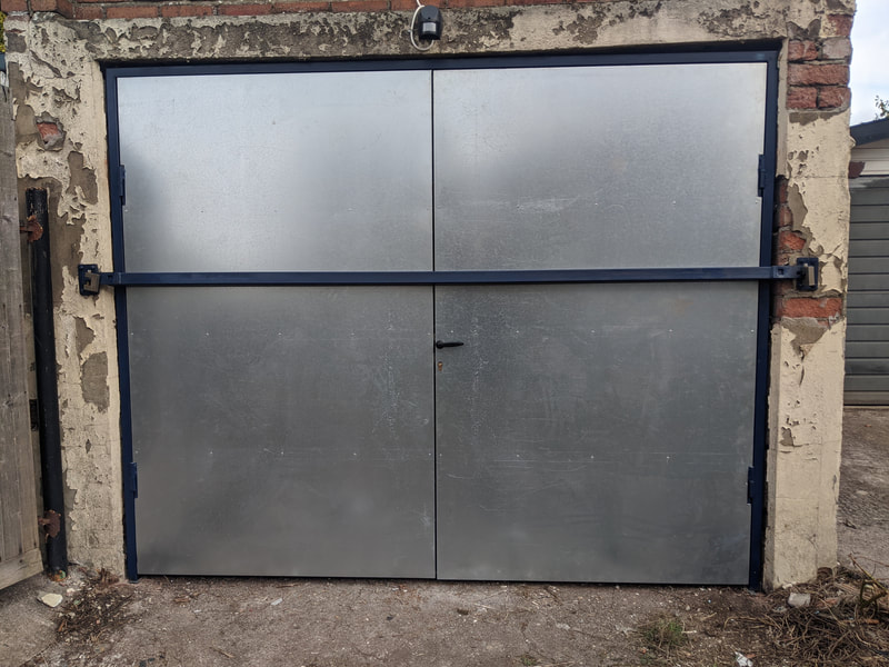 Metal garage door with galvanized sheet