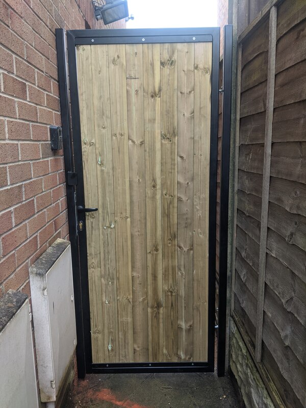 Steel gate with timber in-fill for side access to this property