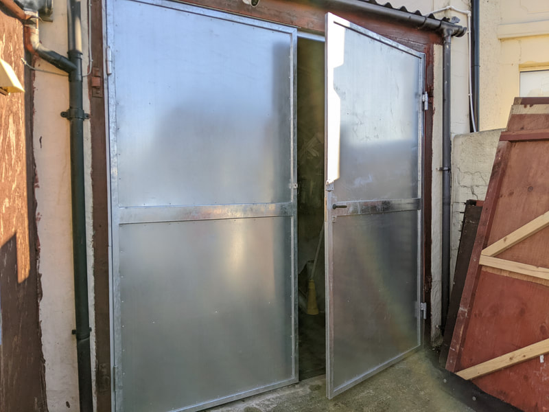 Metal garage door with galvanized sheet