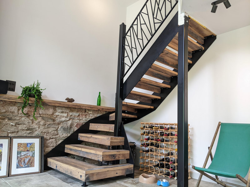 Steel staircase with metal stringer and timber treads