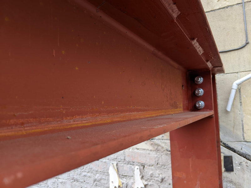 RSJ end plate connection with steel plate welded to beam top for this job in Bath.
