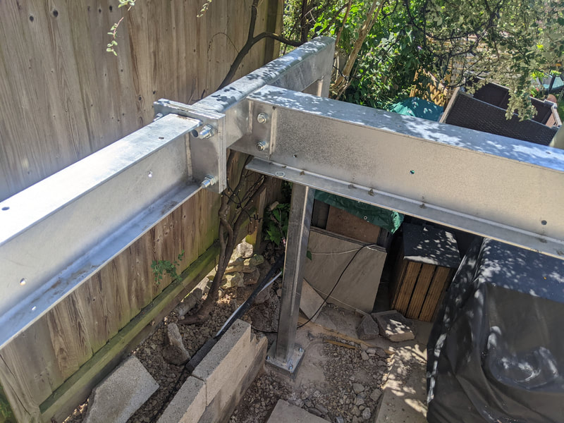 Galvanized structural steel for a raised kitchen extension