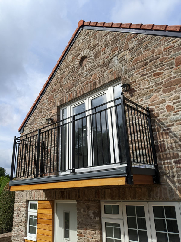 Metal Balcony in Bristol galvanized and powder coated made with chunky steel bar 