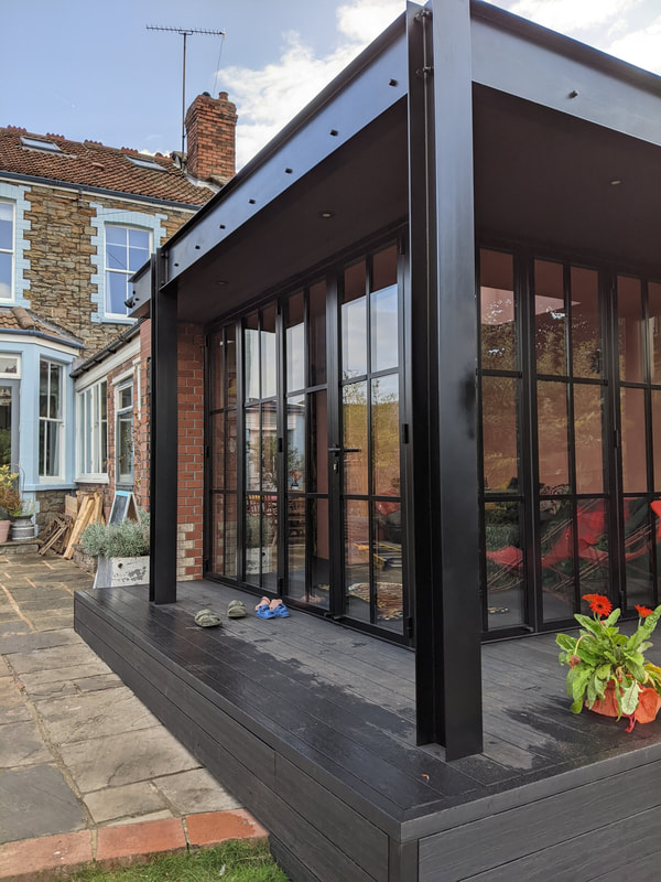 Galvanized and powder coated steel beam structure for this beautifully finished garden room